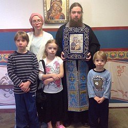 The Campbell family with the Hawaiian icon of the Theotokos.<br/>Ella is holding her IV bag
