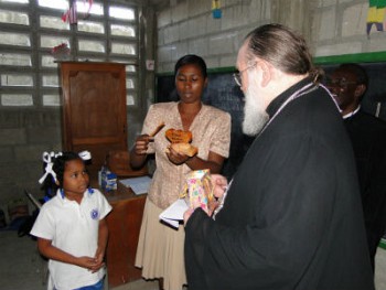 A school student greets Metropolitan Hilarion in Haiti.