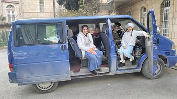 The orphans in the old van. 