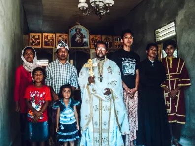 Fr. Aleksander with the Made family, the first family he baptized into Orthodoxy